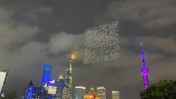 Drones hovered over Shanghai’s futuristic backdrop and a QR code became visible